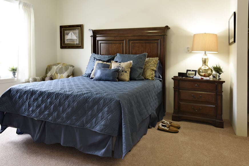 A furnished bedroom in a Magnolia Heights apartment